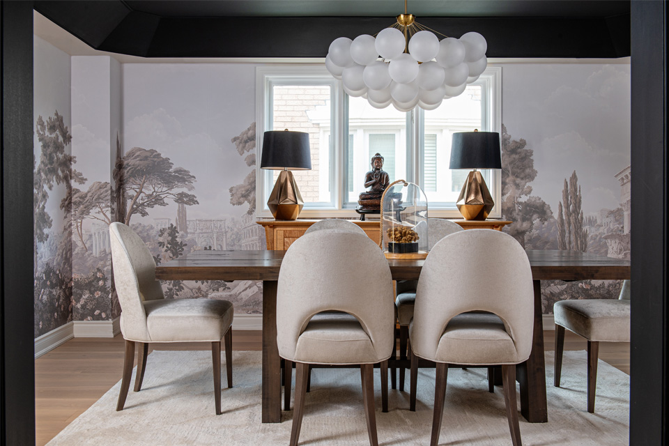 wood flooring with area rug in dining room Design by Aman Than Interiors and Photography by Mike Chajecki 